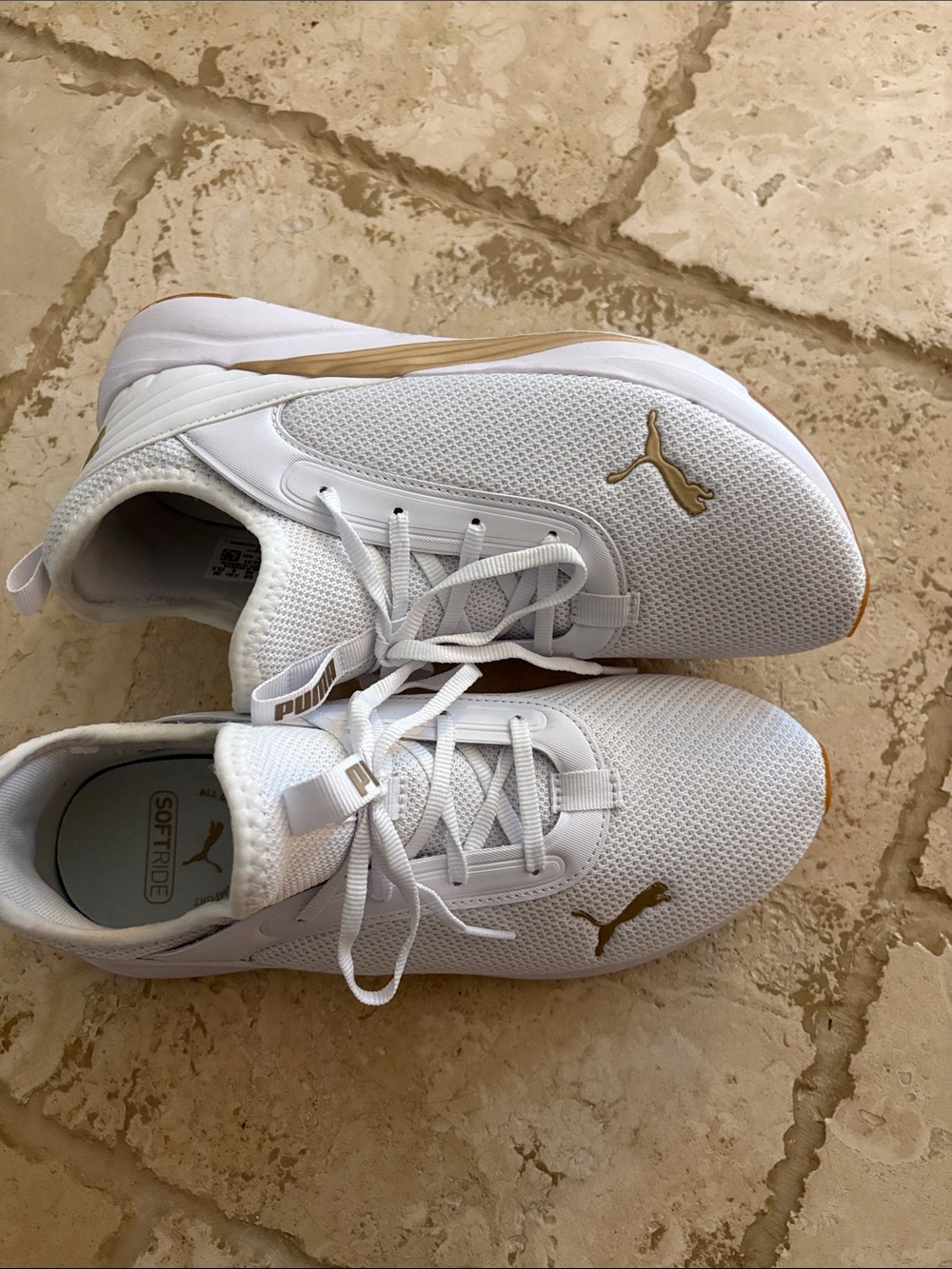 Puma Women’s White and Gold SoftRide Sneakers